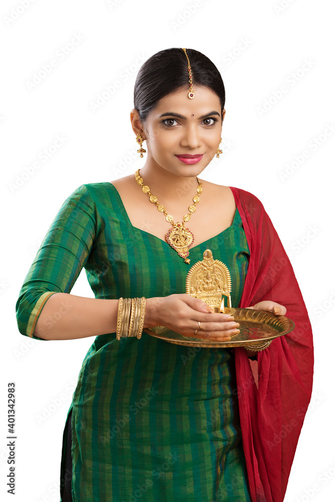 Hindu Indian young women holding Deepam in hands. ( Kamatchi vilakku ) Hindu Indian young women holding Deepam in hands. ( Kamatchi vilakku )