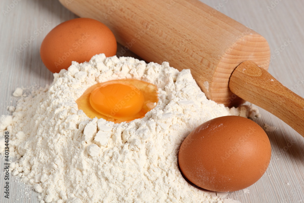 Pile of flour with egg on top Pile of flour with egg on top