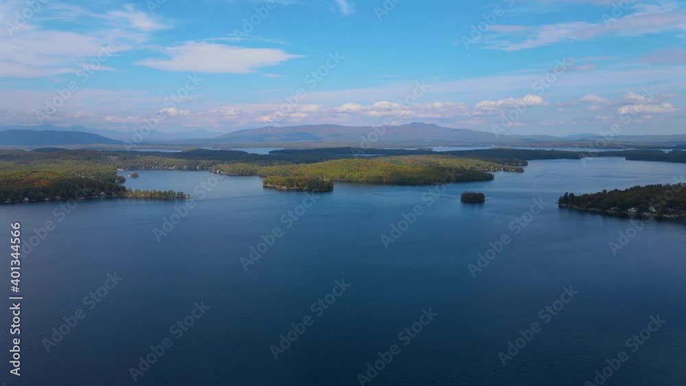 Lake Winnipesaukee and village of Weirs Beach aerial view with fall foliage in City of Laconia, New Hampshire, USA. Lake Winnipesaukee and village of Weirs Beach aerial view with fall foliage in City of Laconia, New Hampshire, USA.