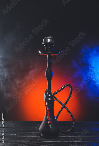 Hookah with fume on dark background