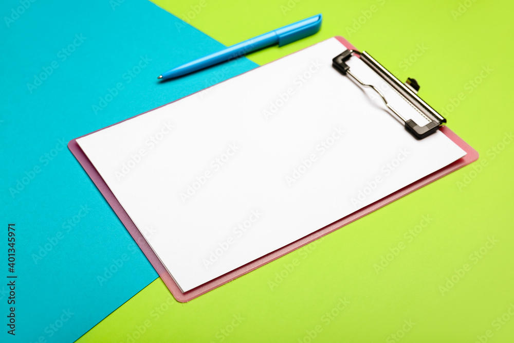 Clipboard with blank paper sheet and pen on color background Clipboard with blank paper sheet and pen on color background