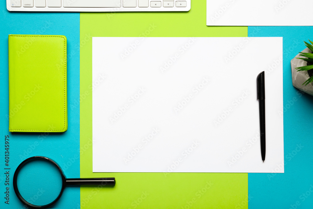Composition with blank paper sheet and stationary on color background Composition with blank paper sheet and stationary on color background