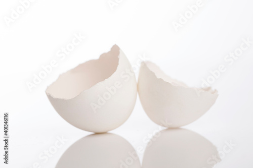 Canvas Print Broken egg shell on white background.