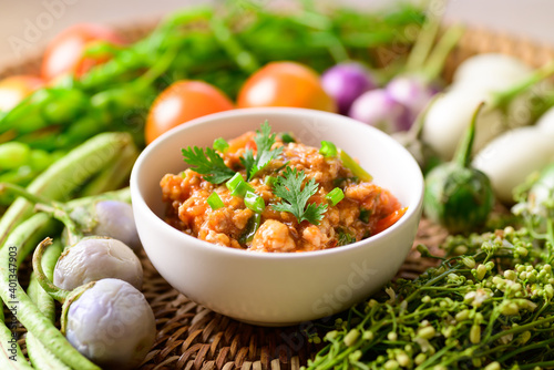 Northern Thai food (Nam Prik Ong), Spicy chili minced pork with tomatoes, Thai chili paste eating with vegetables