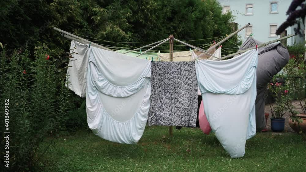 A laundry hanging on the rope and moving during wind
