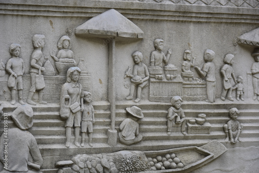 Cement sculpture tells the story of Thai people in the past.