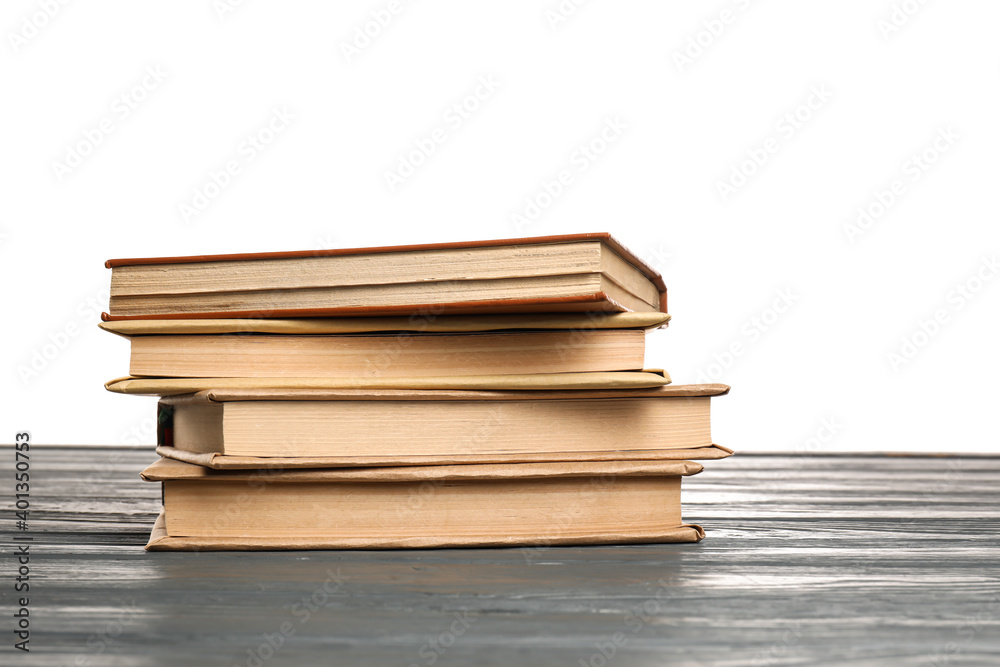 Old books on table against white background Old books on table against white background