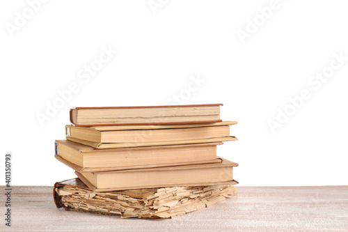 Stacked old books on wooden...