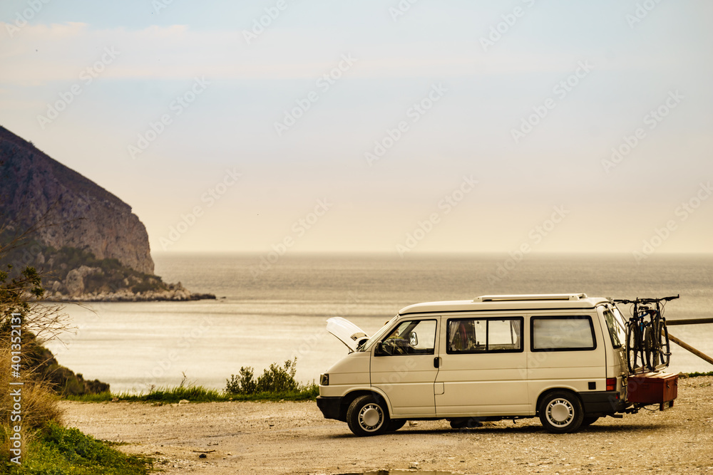 Broken camper van on seaside cliff, Spain