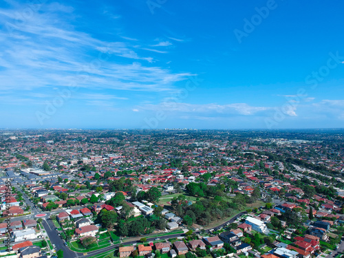 Panoramic Aerial View of Sydney Western suburbs showing house roof tops roads cars and other buildings 