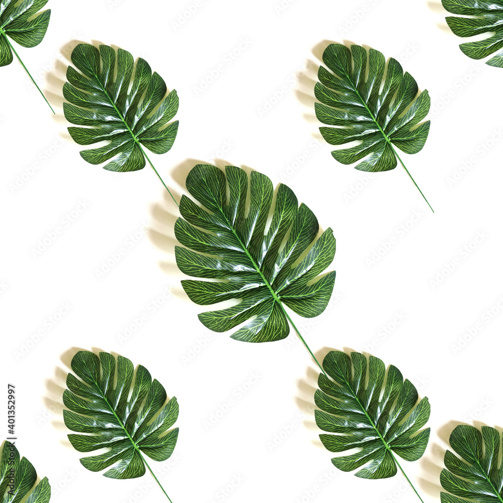 Fototapeta premium Green tropical leaves. Seamless background