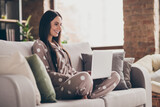 Profile photo of nice optimistic girl sit write laptop wear pijama at home