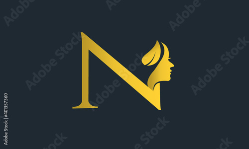 N logo with lady face with golden color
