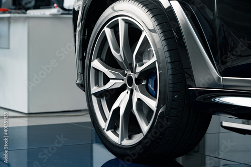 Aluminium rim of luxury car wheel close up