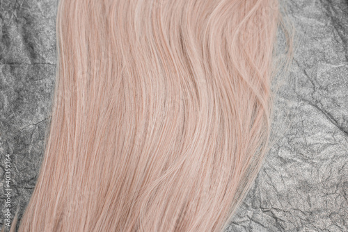 Wigs, natural and synthetic hair. Women's beauty concept. Close up photo of wig, hair for ladies