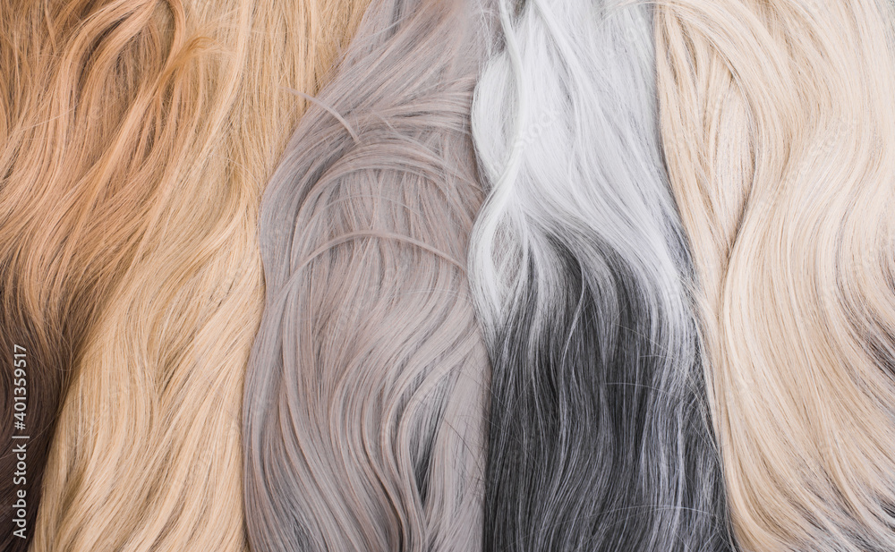 Naklejka premium Wigs, natural and synthetic hair. Women's beauty concept. Close up photo of wig, hair for ladies