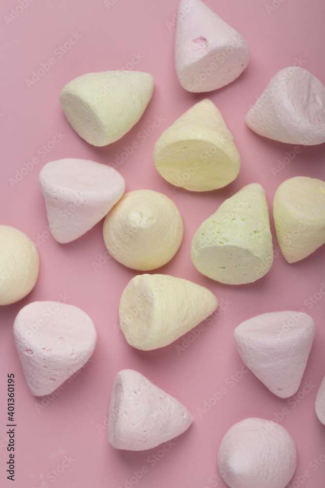 Marshmallows colorful chewy candy, over pink background . Close up . Vertical Shot Marshmallows colorful chewy candy, over pink background . Close up . Vertical Shot