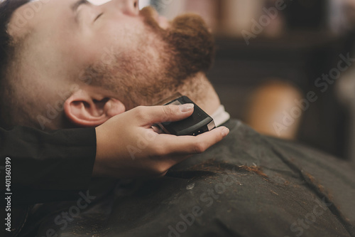 man gets a shave in the salon