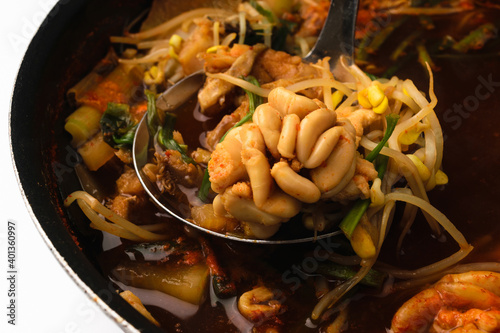 Cooking fish broth on a white background photo