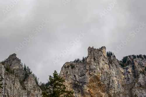 rugged mountains and grey clouds at the sky © thomaseder