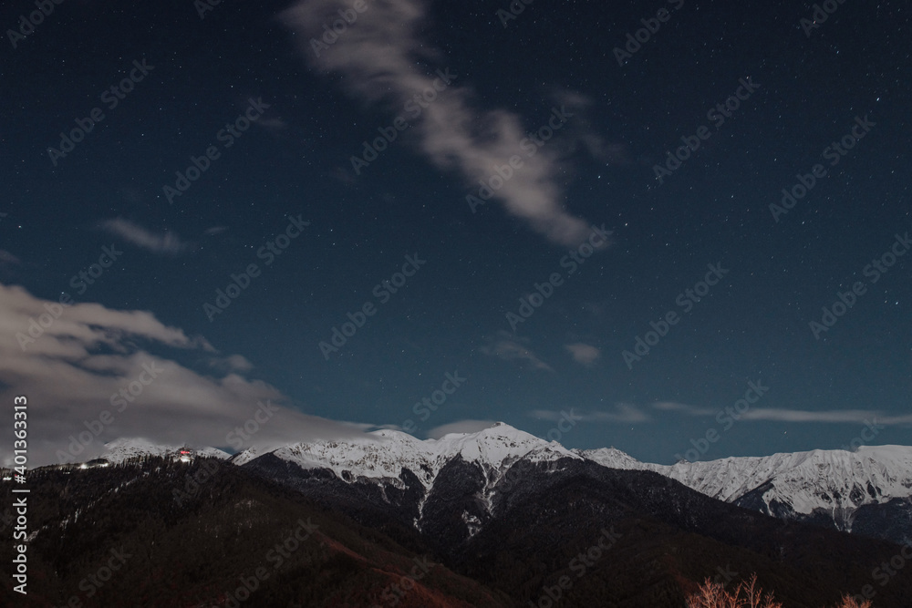Long exposure photograph of the mountains at night. There are many stars in the sky Long exposure photograph of the mountains at night. There are many stars in the sky