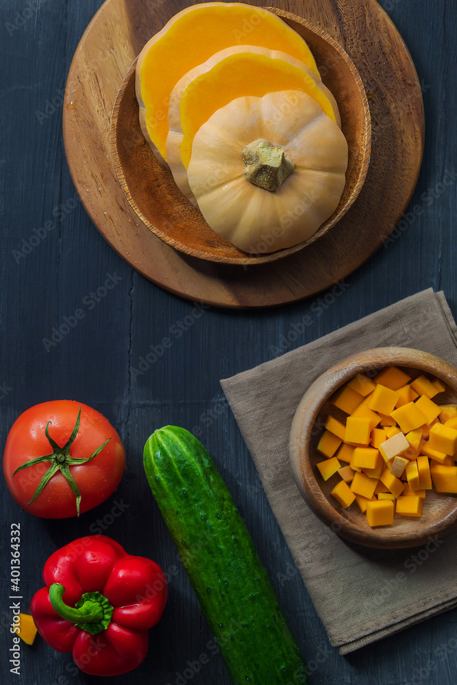 Fresh vegetables for cooking vegetarian dishes are on a black background