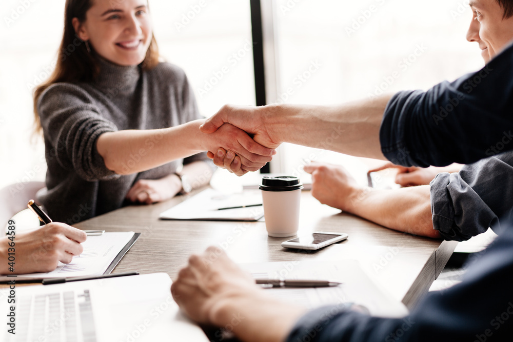 close up. smiling business woman shaking hands with her colleague . close up. smiling business woman shaking hands with her colleague .