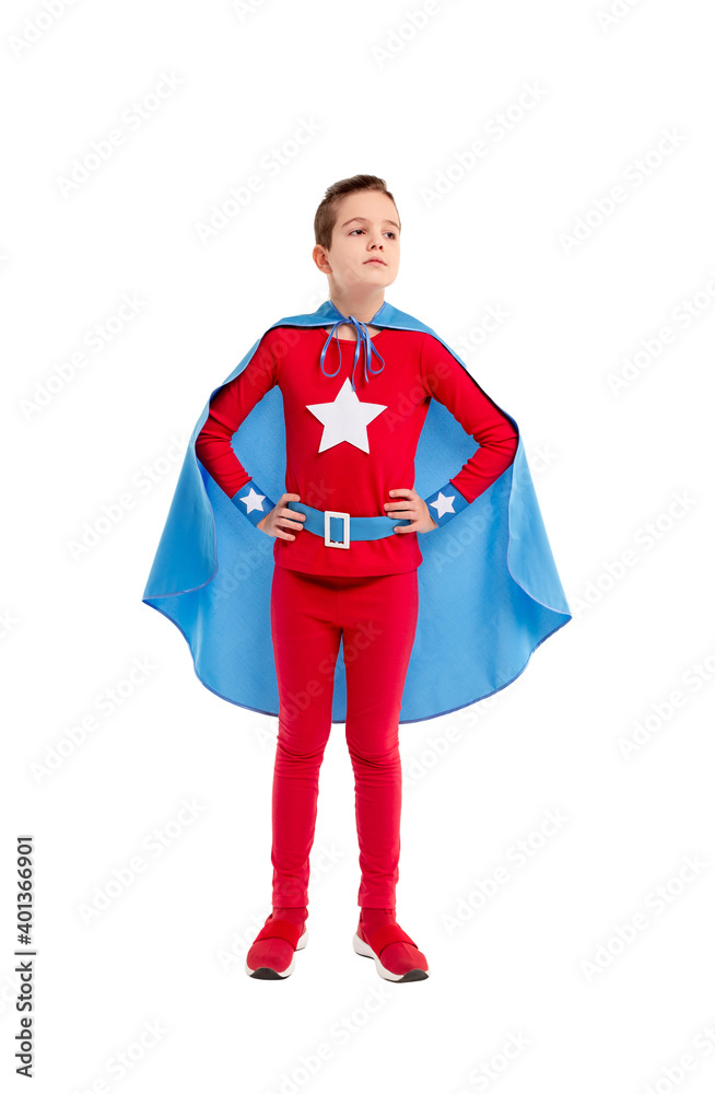 Confident little superhero looking away Confident little superhero looking away