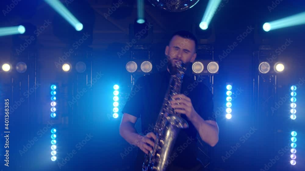 Live performance of emotional energetic saxophonist man with saxophone