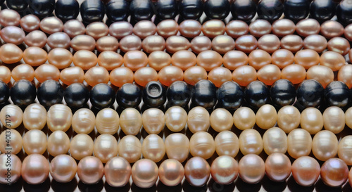 Necklace of black and yellow pearls close-up