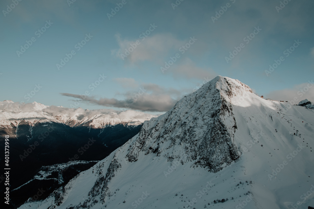 Rosa Khutor. High mountain, above the clouds. Snow-capped mountain top.