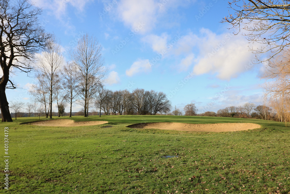 Two bunkers with trees in background during winter in the UK