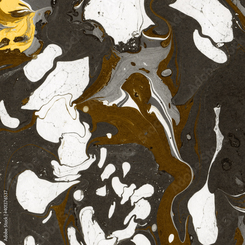 Gold luxury marble ink texture on watercolor paper background. Marble stone image. Bath bomb effect. Psychedelic biomorphic art.