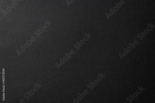 しわ状の質感のある黒い紙の背景テクスチャー
