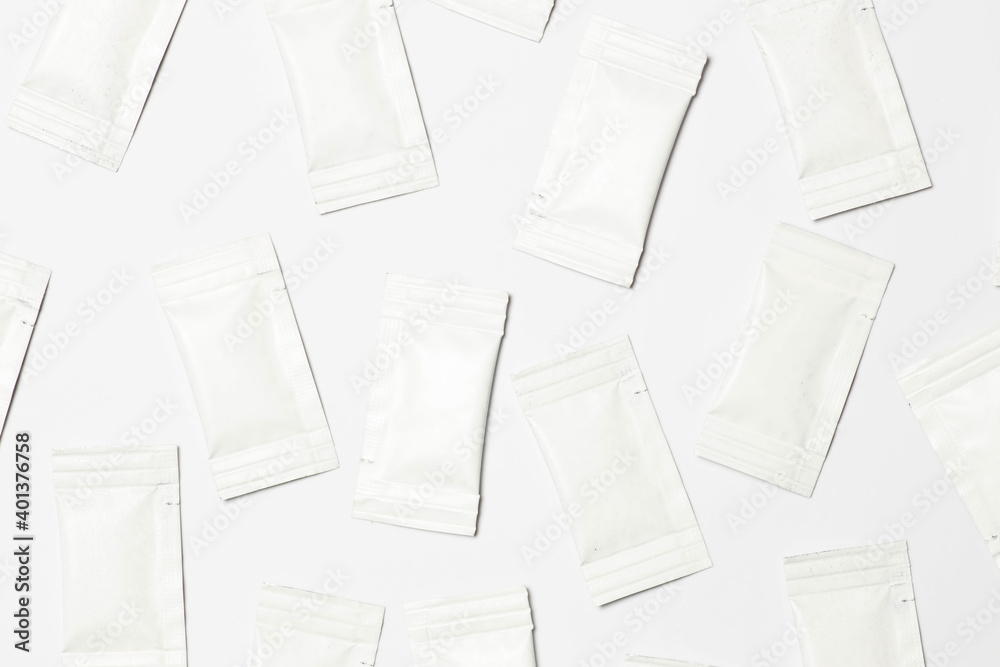 Close-up composition of white sachets on a white background. Close-up composition of white sachets on a white background.