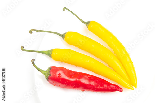 yellow, red hot chili on a plate. Pepper. Vegetable vitamin food. © photosaint