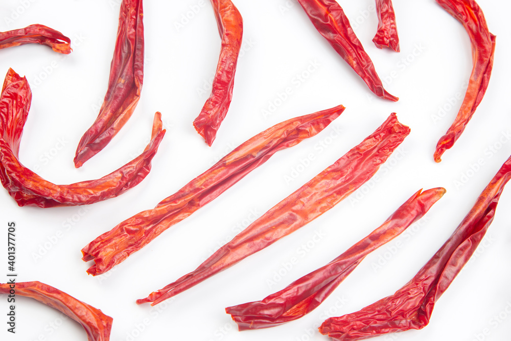 red dried hot peppers on white background