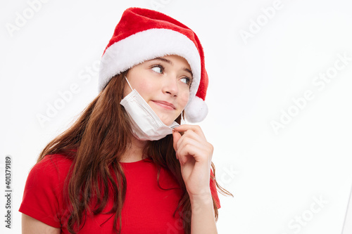 girl wearing santa hat medical mask smile holiday christmas