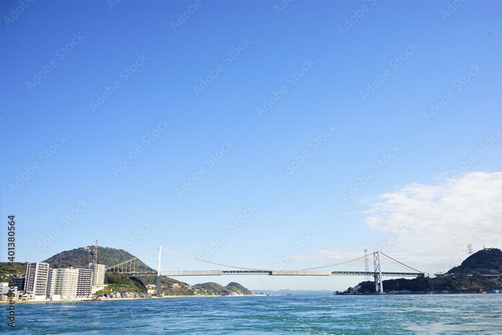 Naklejka premium Kanmon Bridge from Kanmon line ferry in Shimonoseki, Fukuoka, Kitakyushu, Japan - 北九州 福岡 下関 関門橋