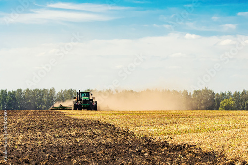 The tractor plows the land. Agriculture image