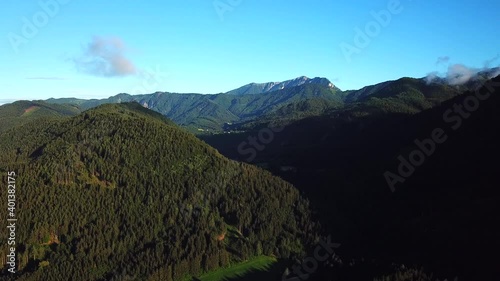 Aerial view above mountain ridges near Paternion, Austria, on a sunny day photo