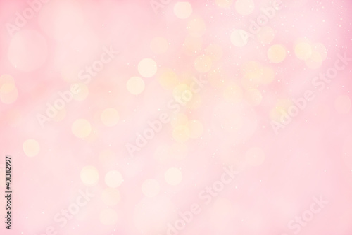 Tender festive abstract background with lights, soft pink and yellow bokeh