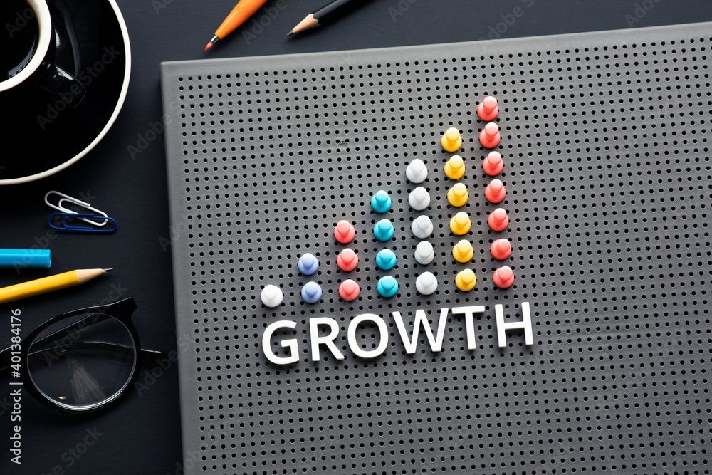 Growth text with pin garph chart on business table.vision to success ...
