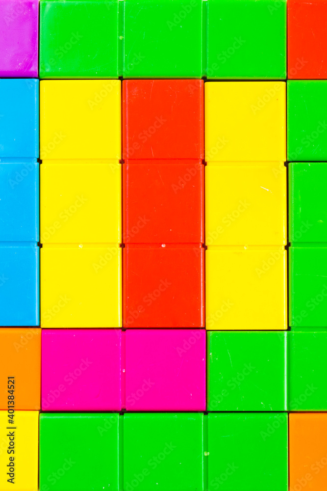 Colorful puzzle cubes background, geometric figures, table game Colorful puzzle cubes background, geometric figures, table game