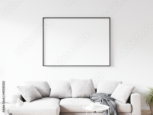 Horizontally oriented rectangular picture frame with thin black border hanging on white wall above sofa in living room. 3D illustration.