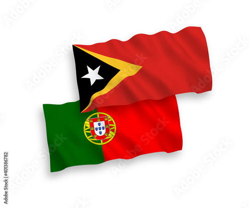 National vector fabric wave flags of Portugal and East Timor isolated on white background. 1 to 2 proportion.