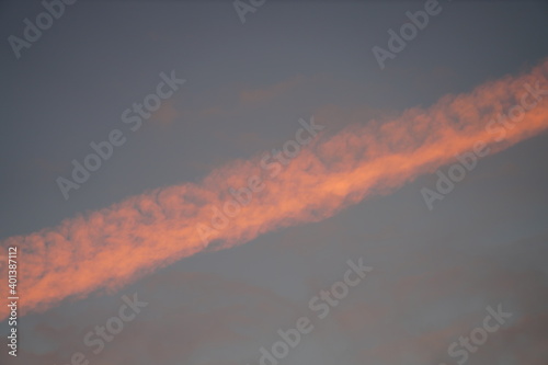 Airplane contrail at sunrise