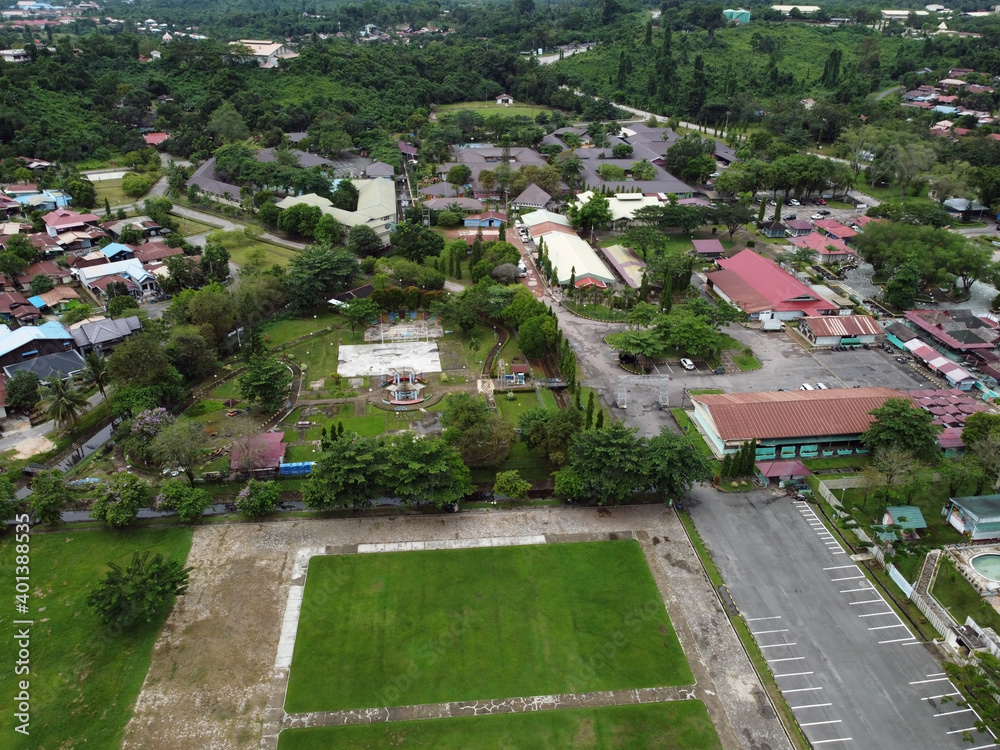 Aerial View over a public park with many residential houses in the distance. Location: East Kutai, East Kalimantan/Indonesia