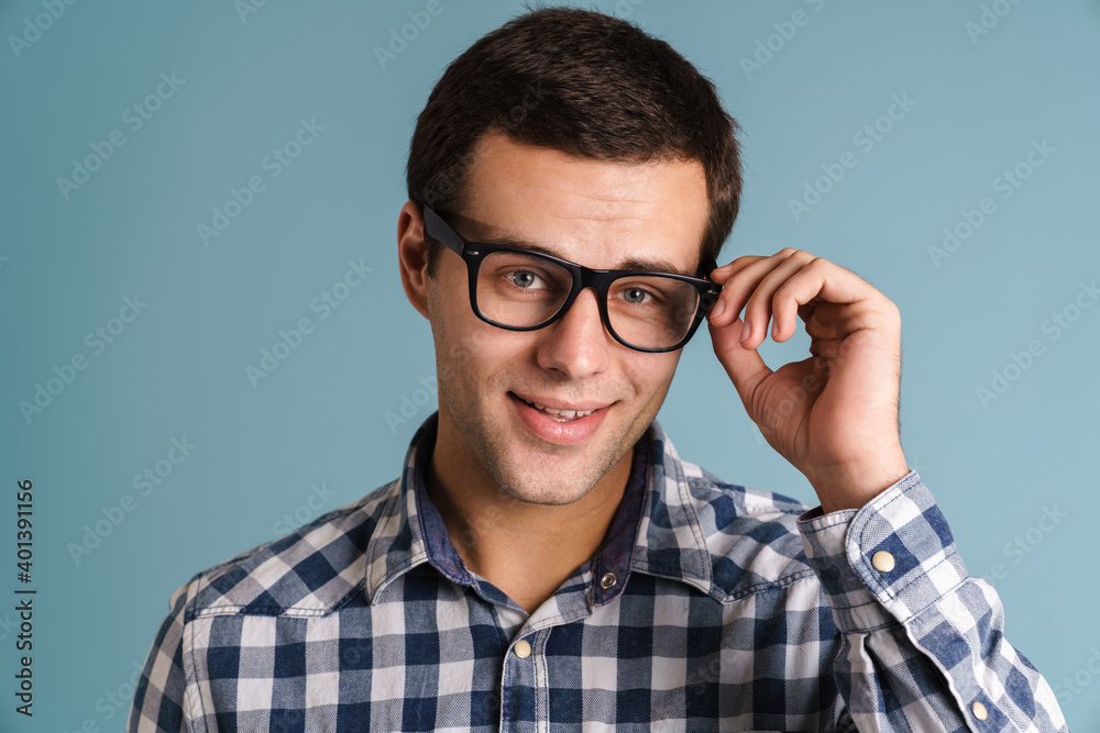 Portrait of happy smiling man isolated on blue Portrait of happy smiling man isolated on blue