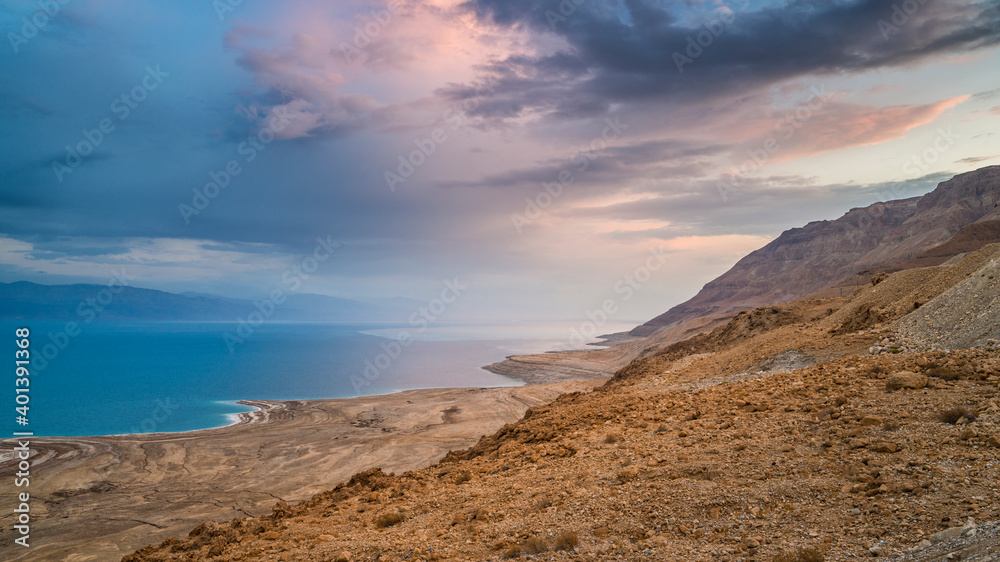 Beautiful Israeli landscape: clouds over the Dead Sea, the lowest place on Earth, its north-western shore covered in sinkholes